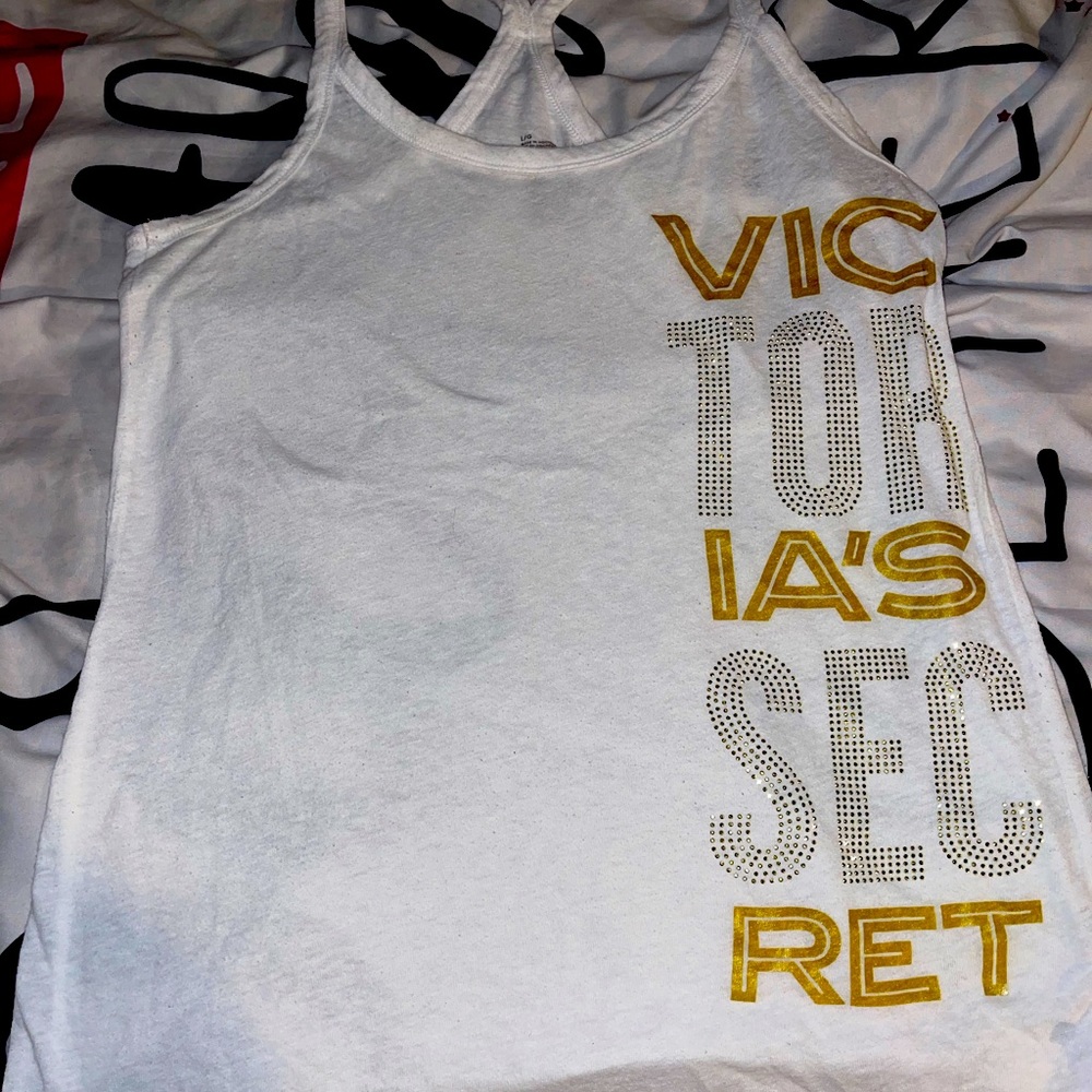 This is large Victoria secret sleeveless shirt 57% Cotton 43% polyester.